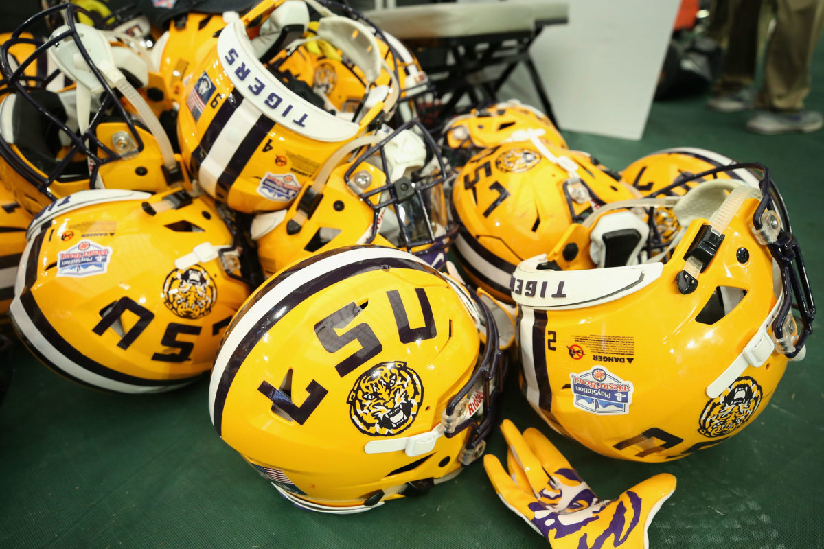 A photo of several LSU football helmets.