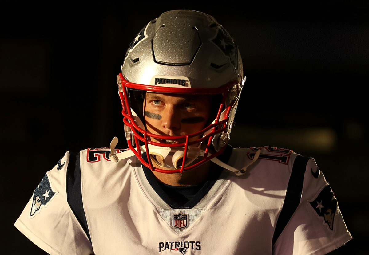 Tom Brady prepares to walk onto the field for the Patriots.
