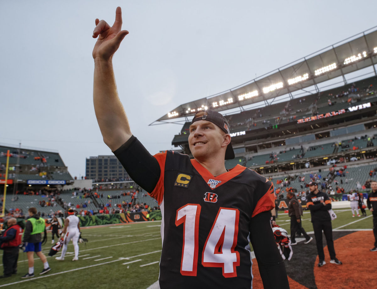 Andy Dalton waves to Bengals fans.