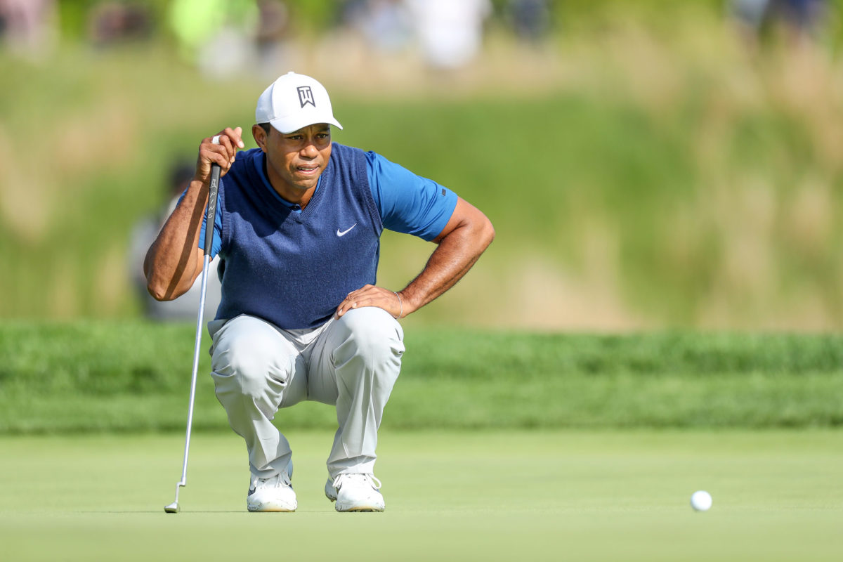 tiger woods looks at a putt at the pga championship