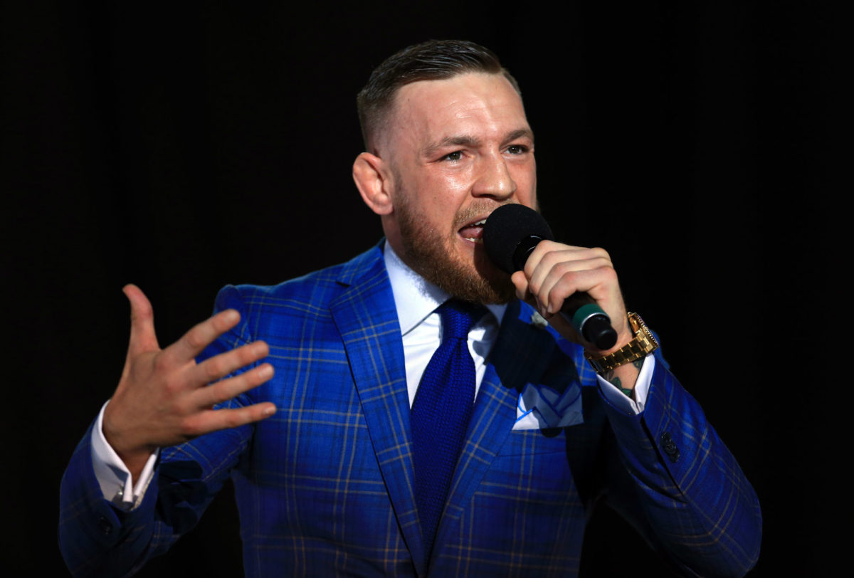 Conor McGregor speaking into a microphone.