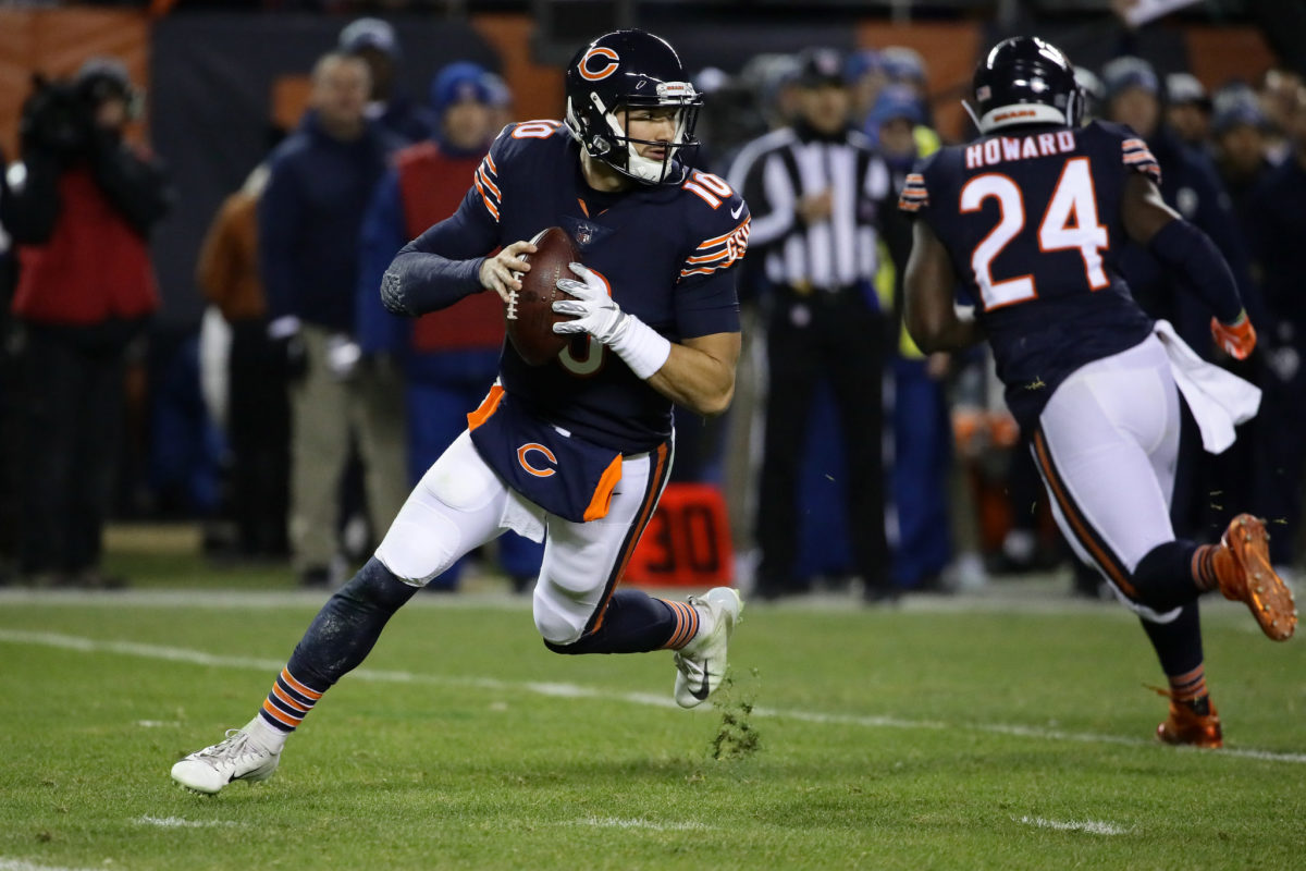 Chicago Bears QB Mitchell Trubisky rolls out during an NFL game.