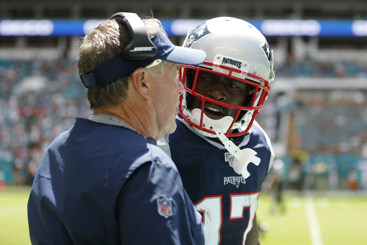 New England Patriots head coach Bill Belichick speaks to Antonio Brown.