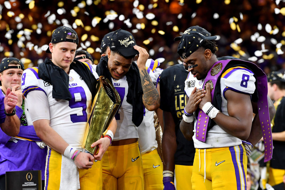 Grant Delpit, Patrick Queen and Joe Burrow celebrate for the LSU Tigers.