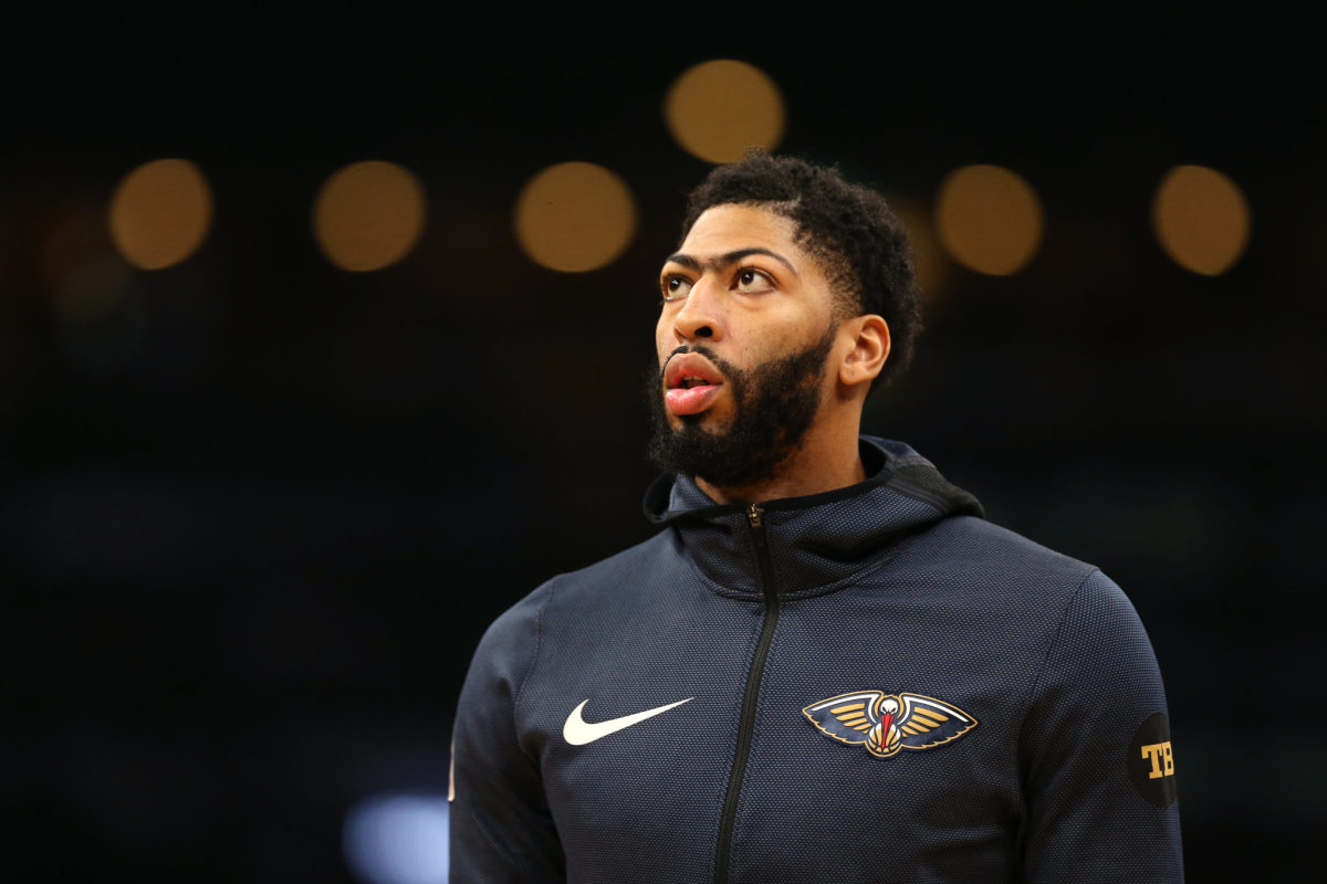anthony davis looks onto the court before a game against boston