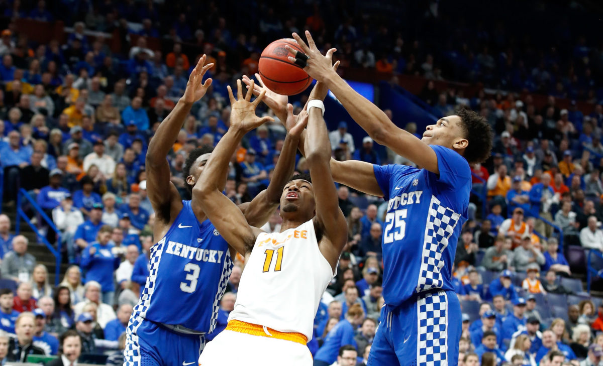 Kentucky and Tennessee players battle for the ball in the SEC Tournament.