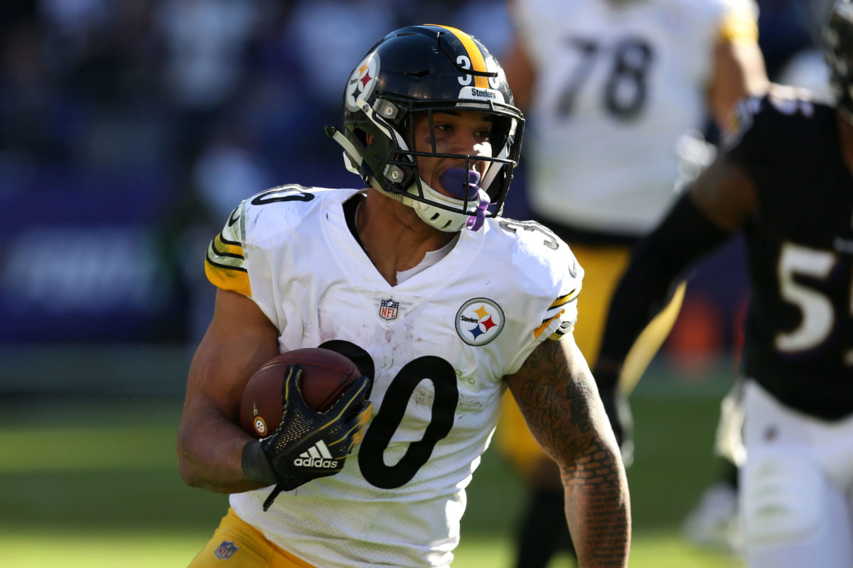 James Conner running the ball for the Pittsburgh Steelers.
