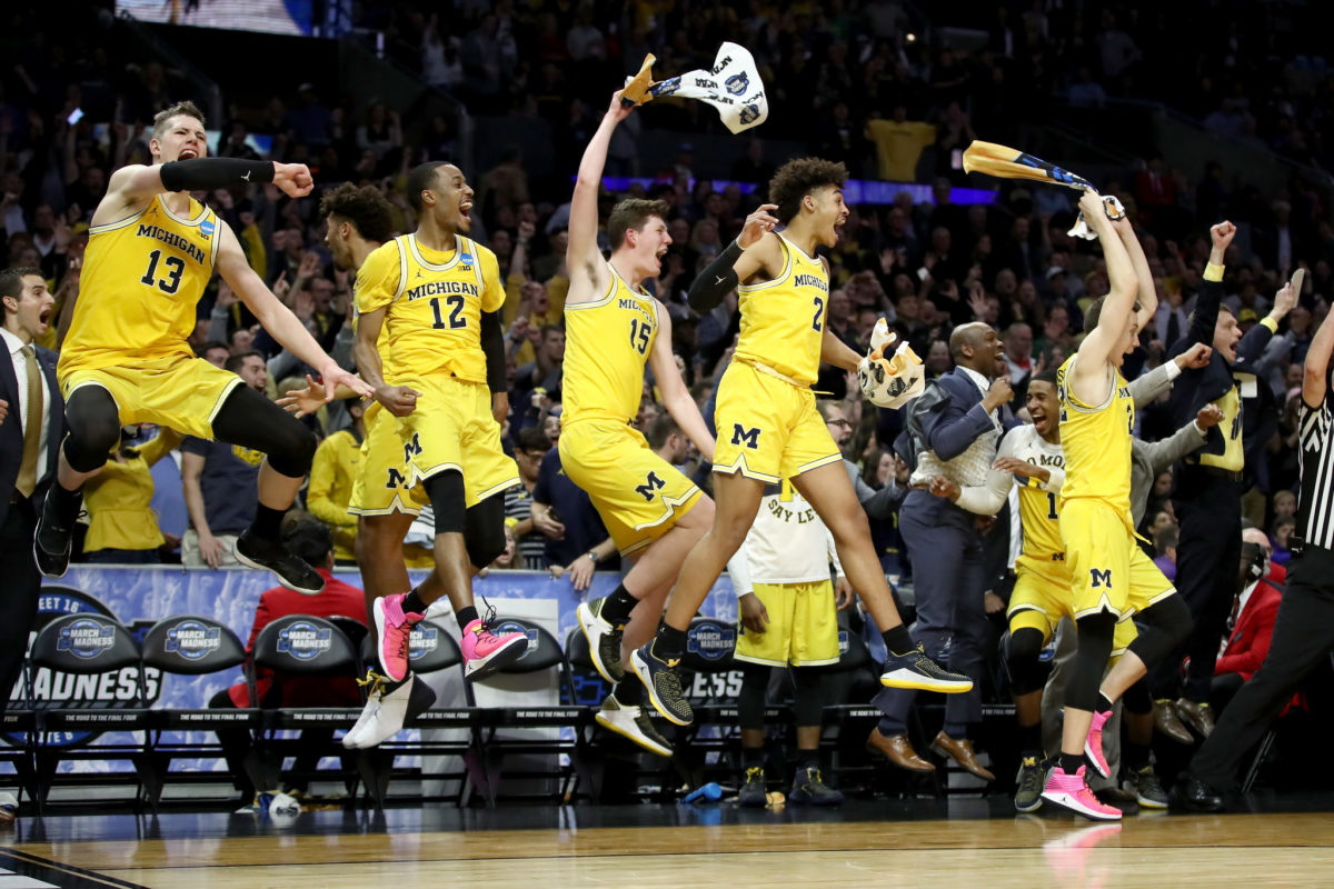 michigan wolverines celebrate in the sweet 16