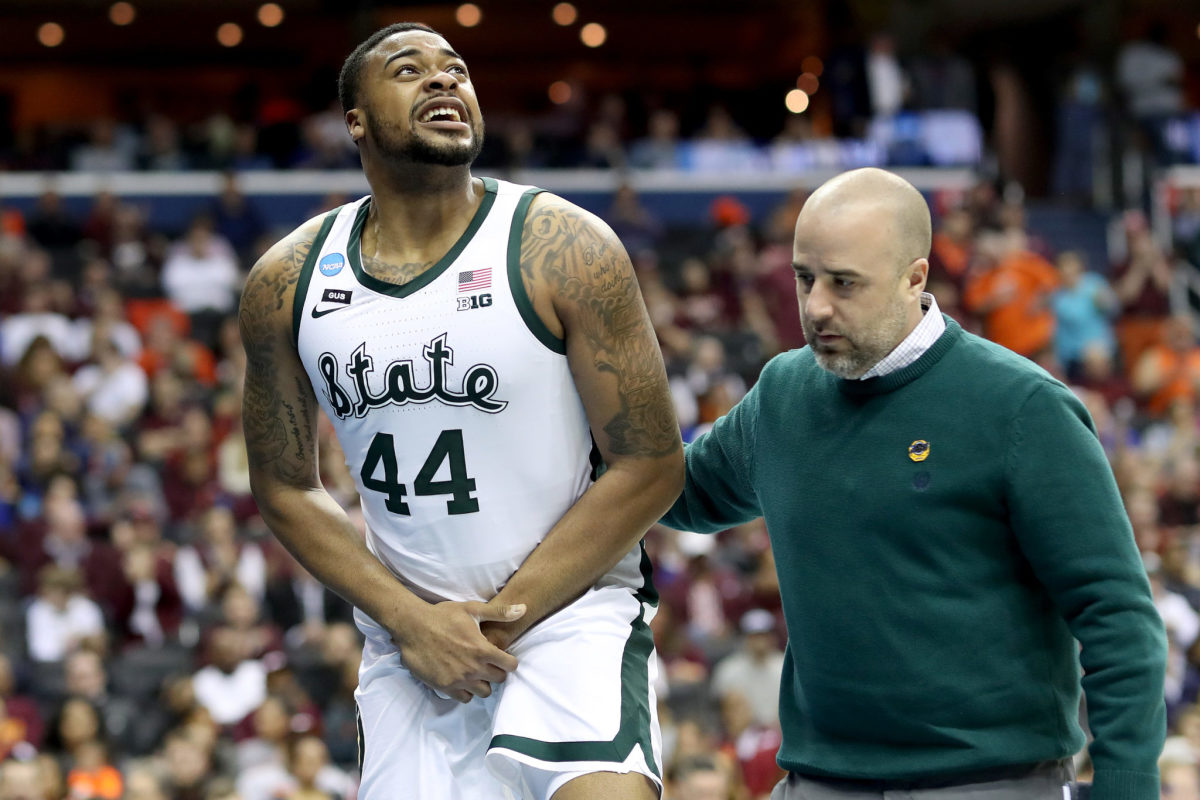 Nick Ward holds his injured hand after scary fall.