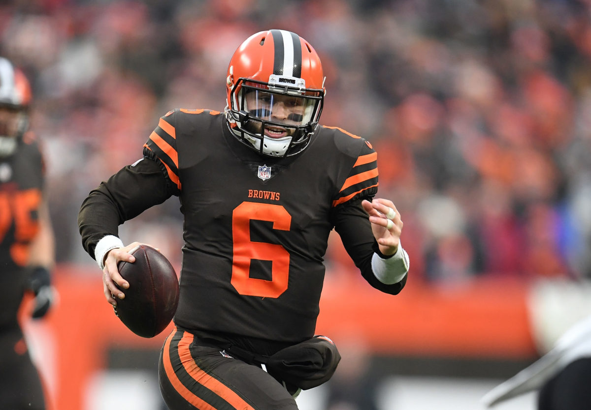 Cleveland Browns QB Baker Mayfield running with the football.