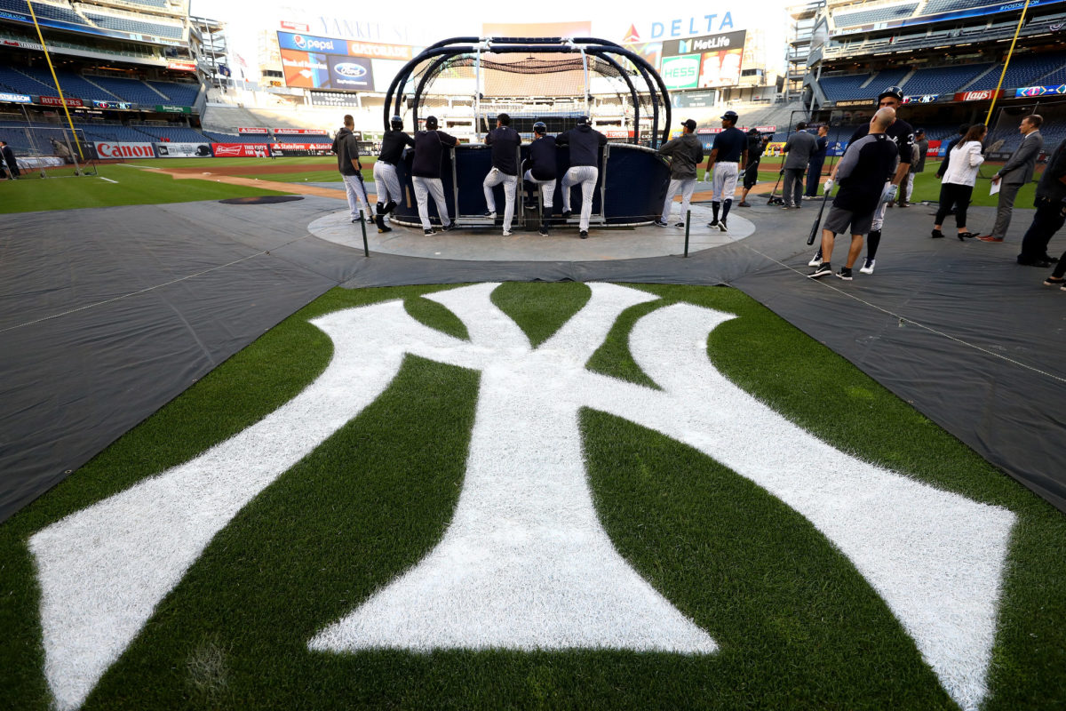 A view of the Yankees logo behind home plate of Yankee Stadium.