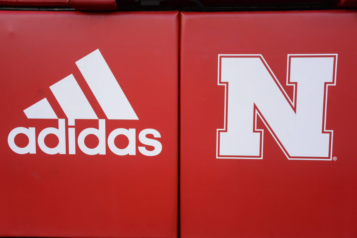 A photo of a Nebraska and adidas logo.