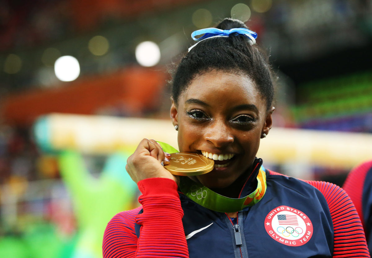 Simone Biles wins a gold medal at the Olympics.
