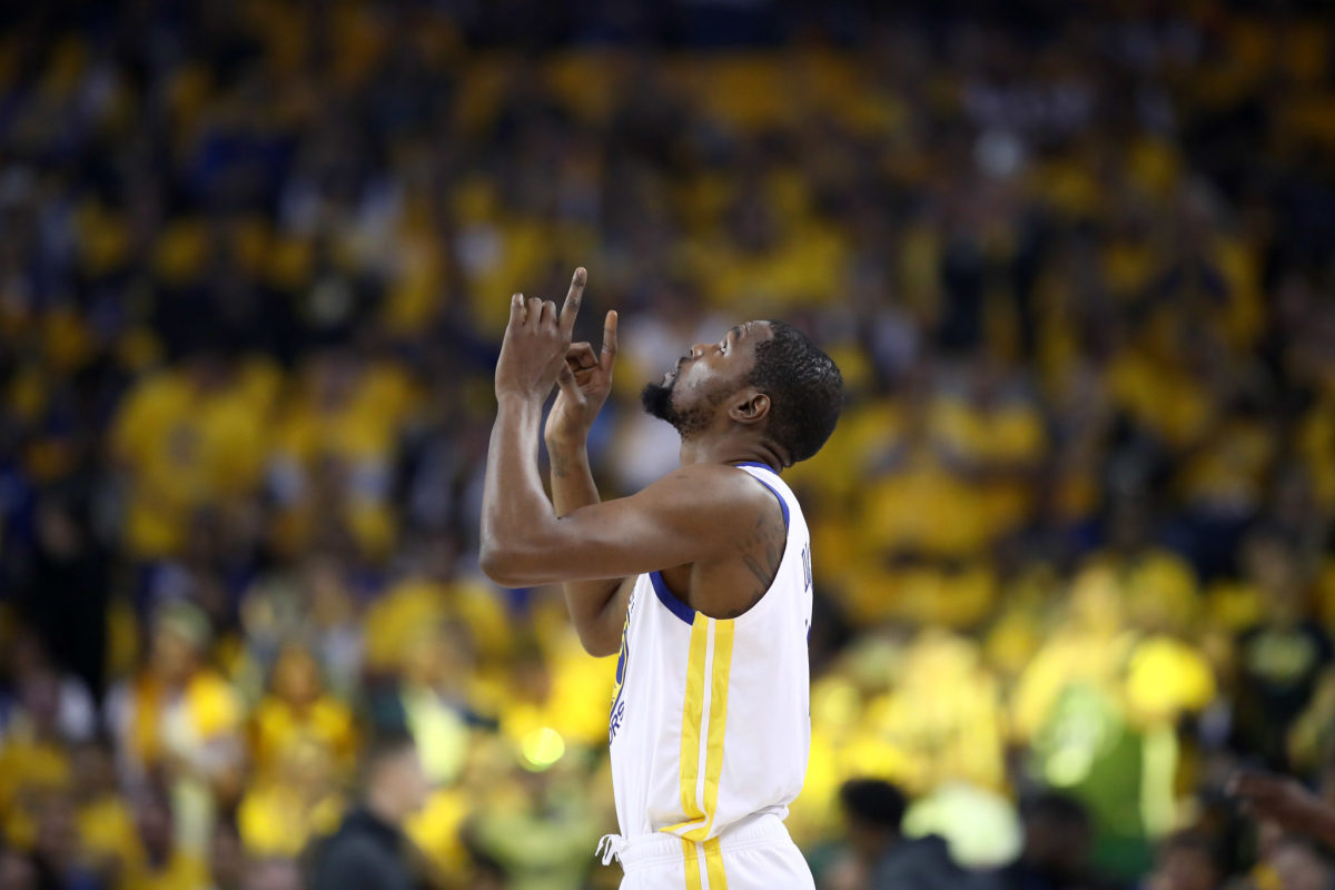 A general photo of Kevin Durant pointing toward the sky.