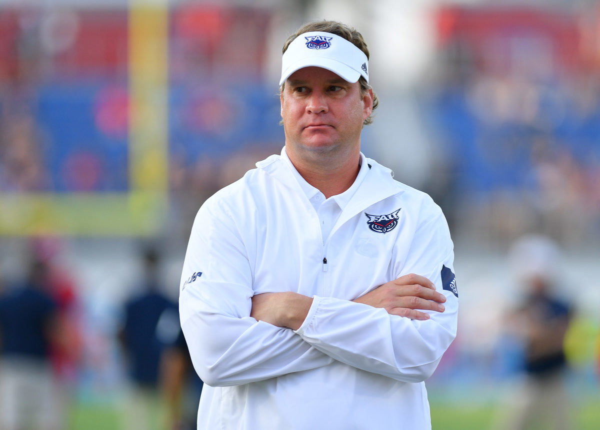 Lane Kiffin on the field before a game at FAU.