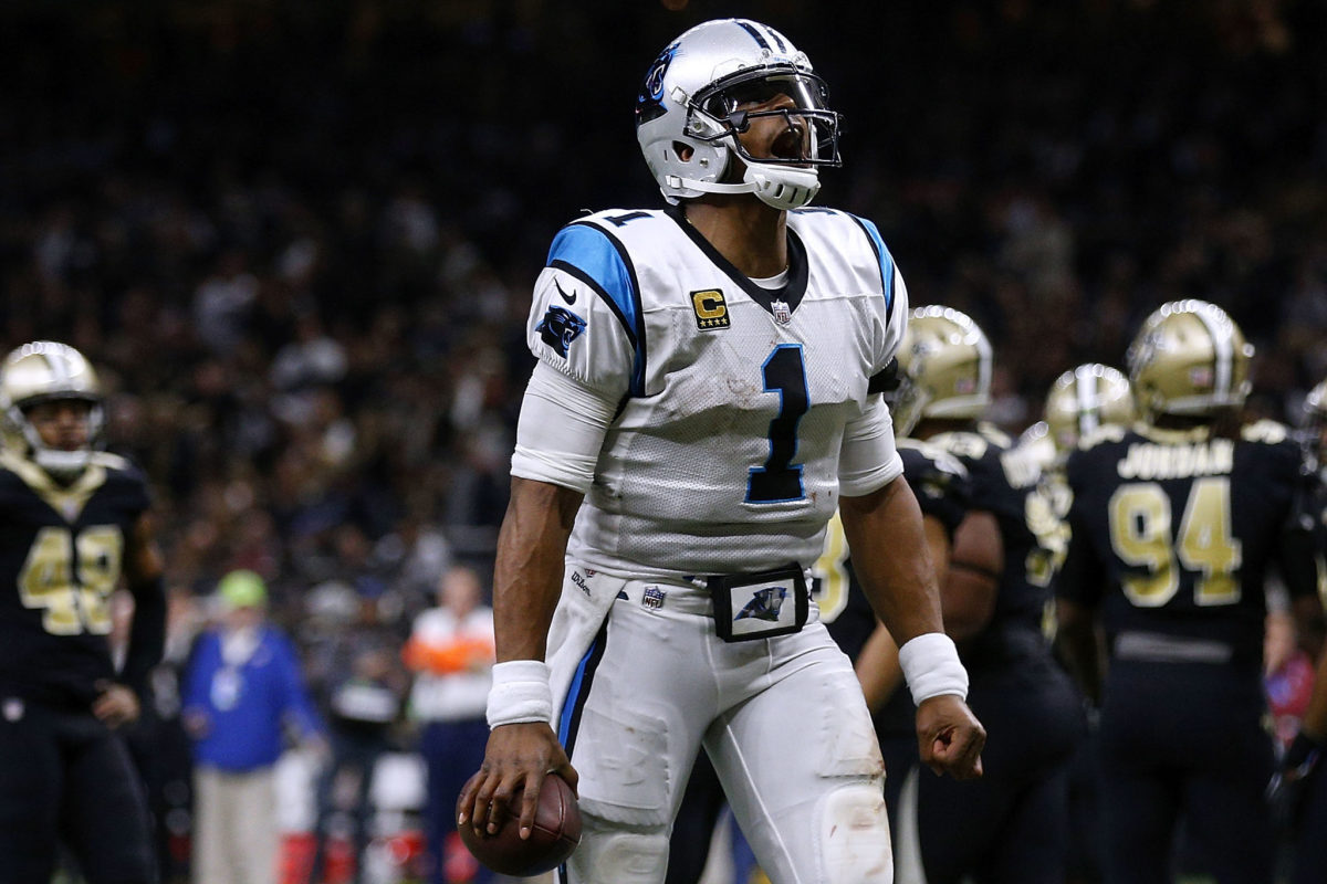 Cam Newton celebrating during a game against the Saints.