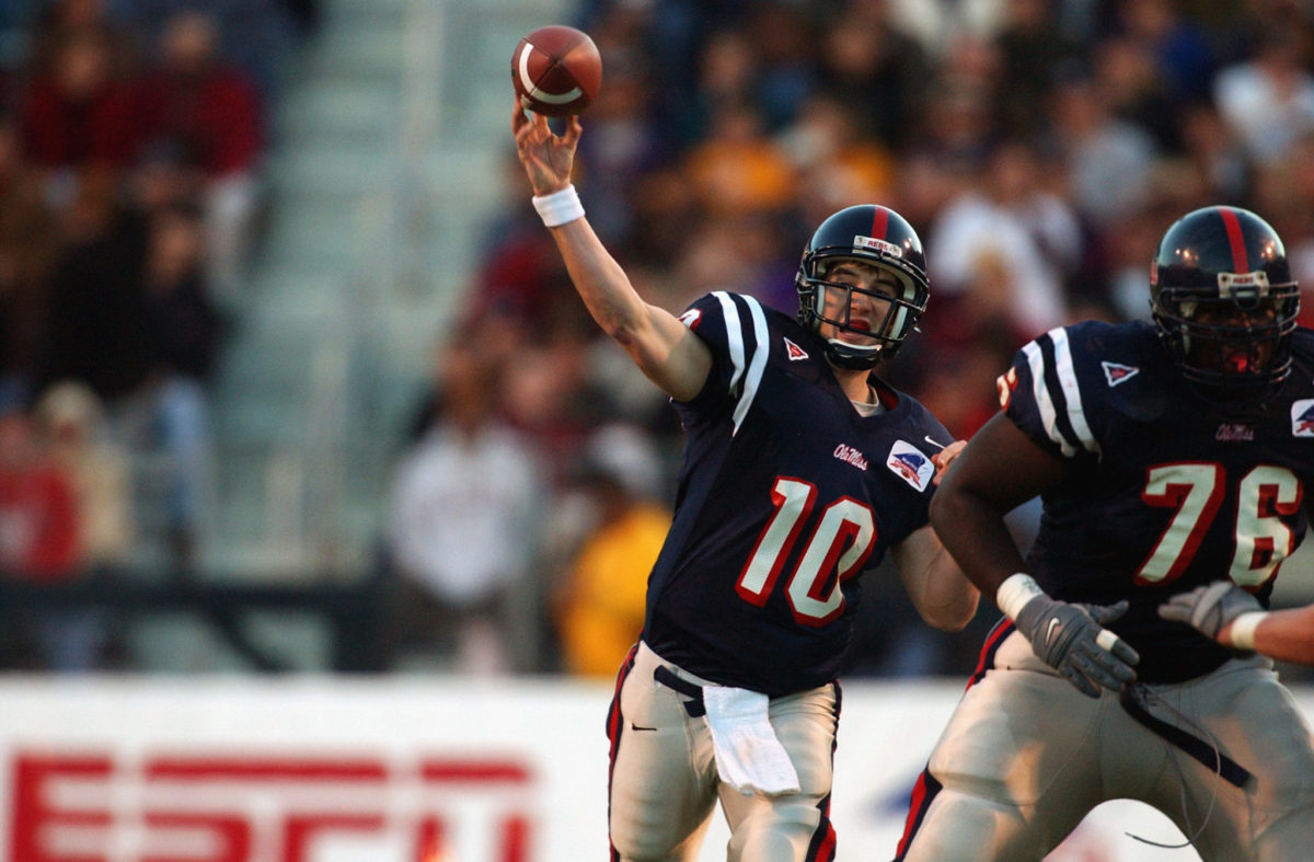 Eli Manning throws a pass back when he played at Ole Miss.