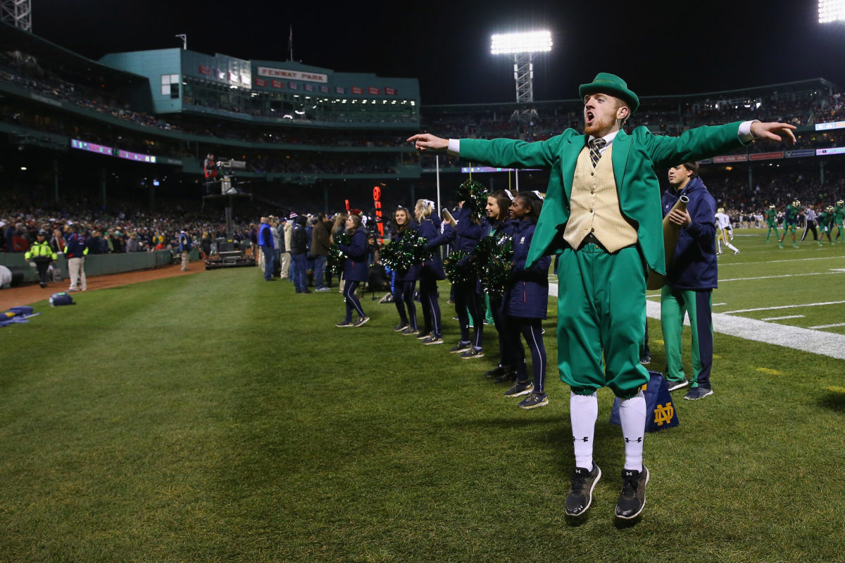 Notre Dame's mascot performing during a game at Fenway park.