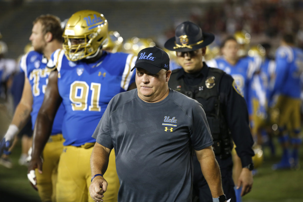 UCLA head coach Chip Kelly walks off the field after loss to Oklahoma.
