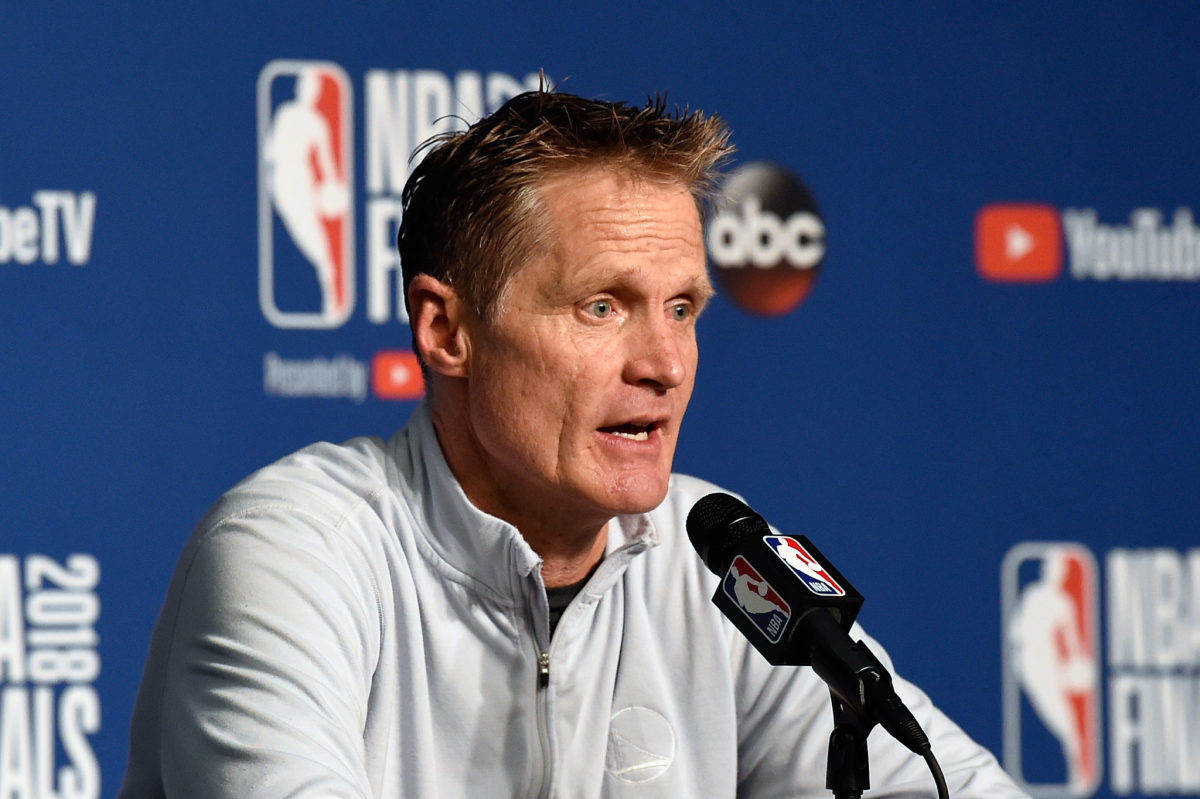Golden State Warriors coach Steve Kerr speaking to the media. Kerr is an outspoken critic of President Donald Trump and his policies.