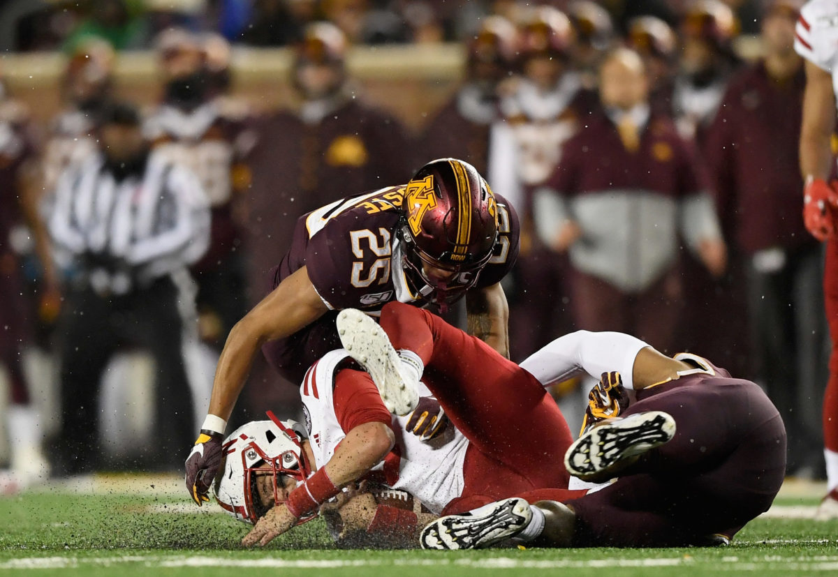 Minnesota defenders take down Nebraska quarterback Noah Vedral.