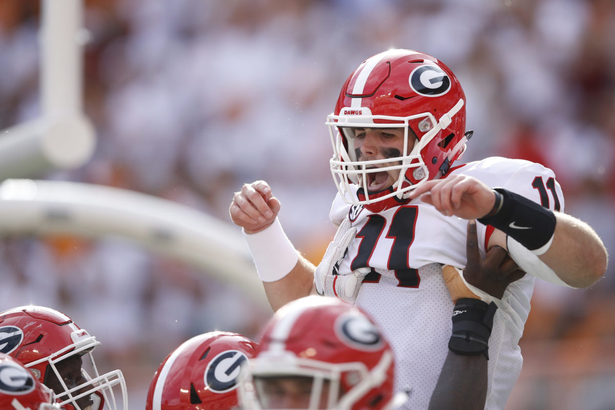 Jake Fromm celebrating a touchdown with his Georgia Teammates.