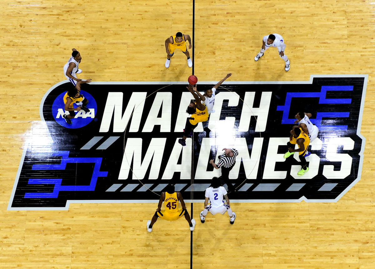 An overhead view of the March Madness midcourt logo ahead of a tipoff during the NCAA Tournament.