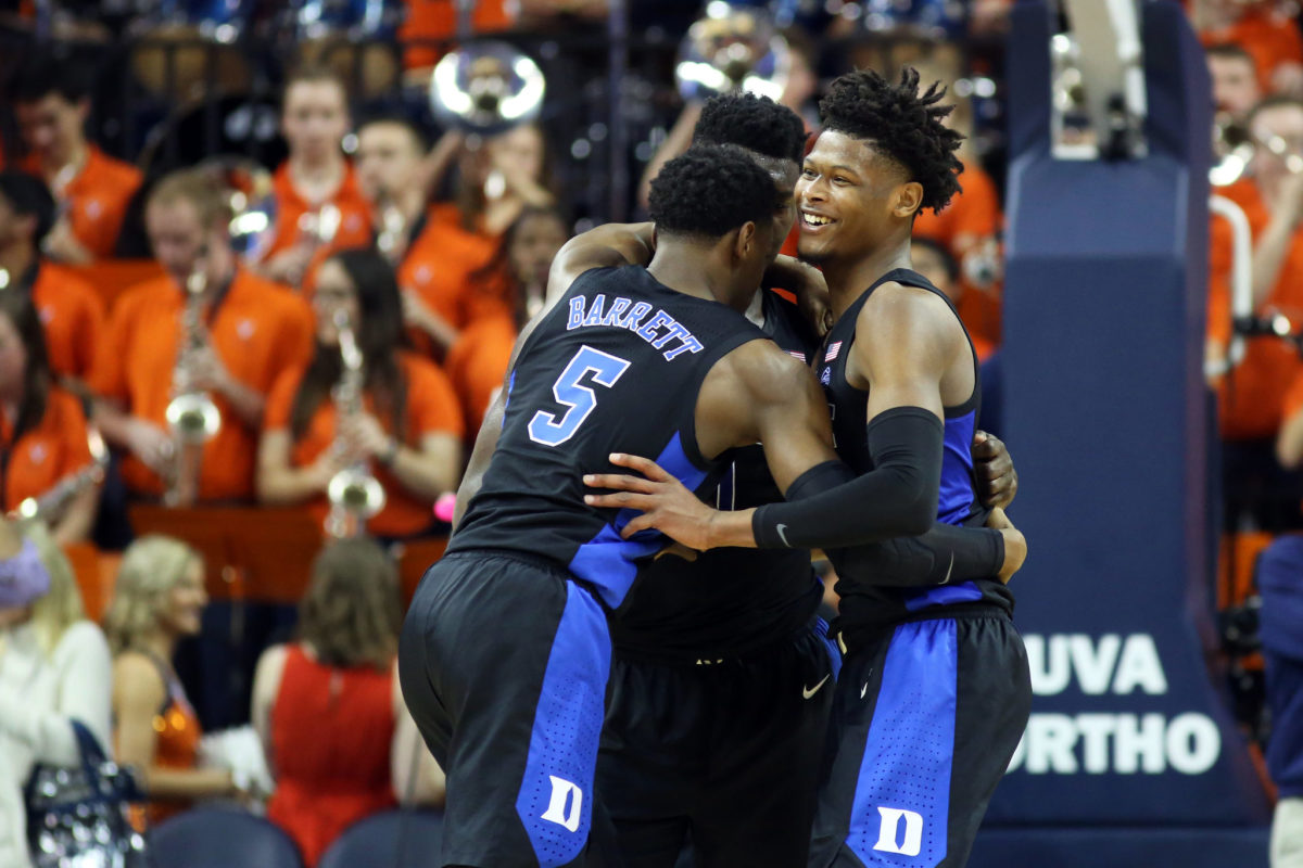 duke players celebrate during their win at virginia