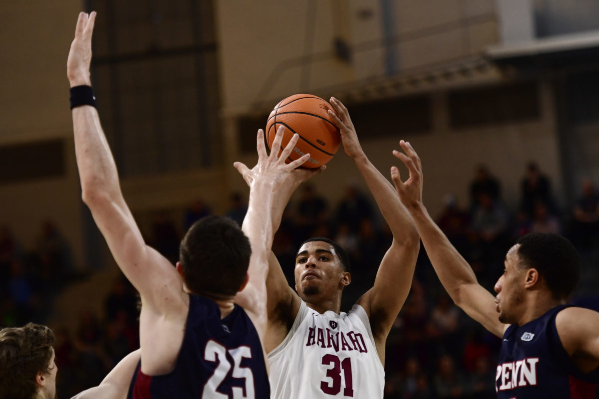 Seth Towns shoots the ball in a game for Harvard.
