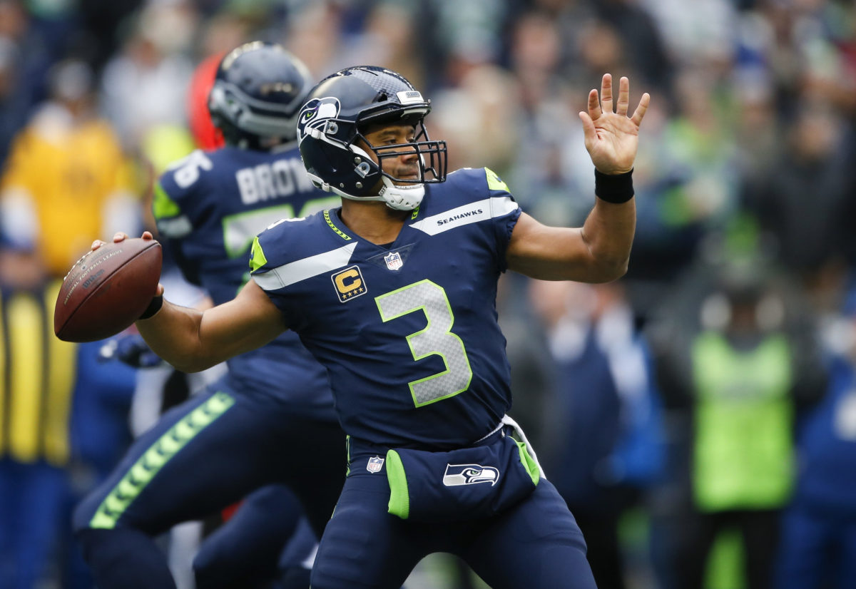 Russell Wilson winding up to pass.