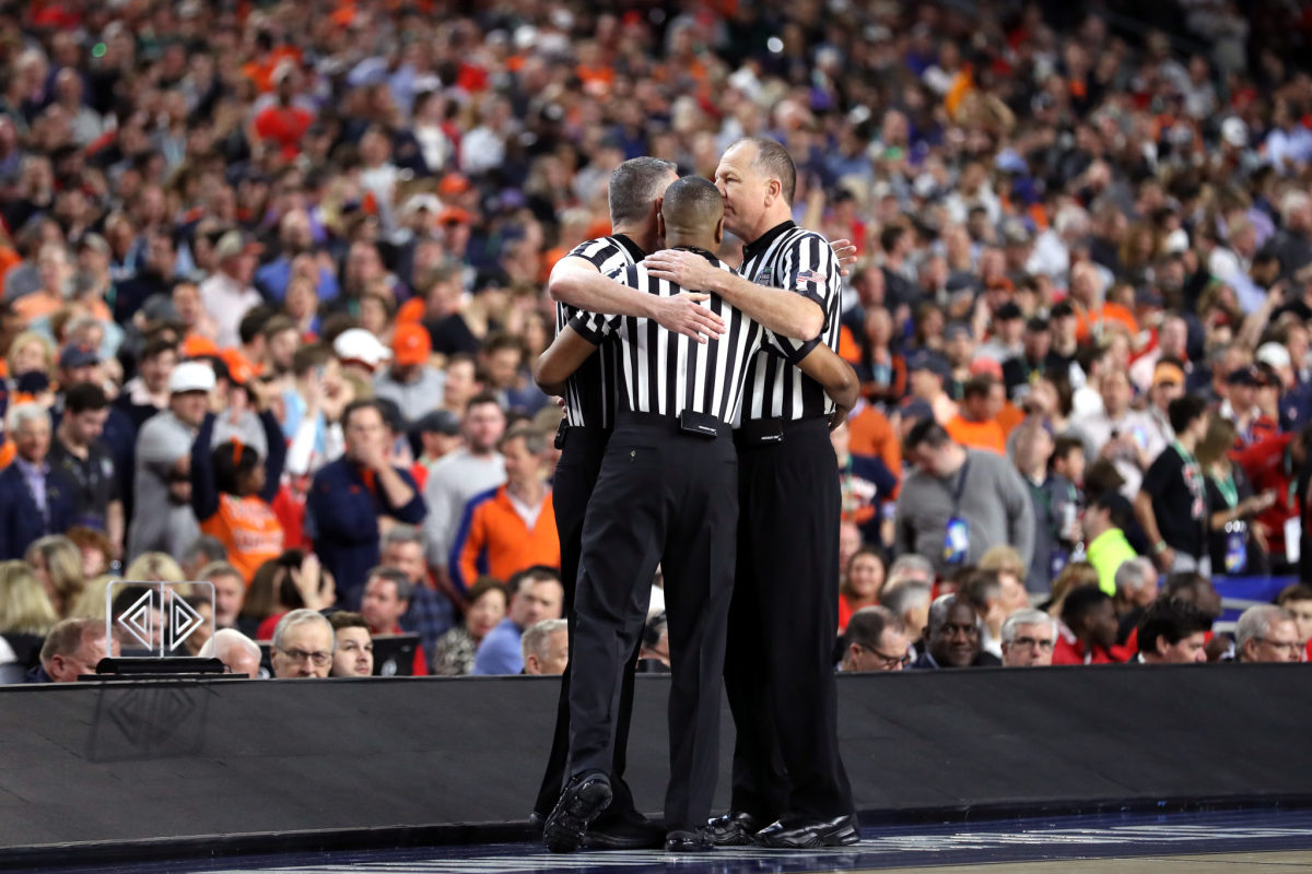 virginia and texas tech get ready to play with the refs on the court