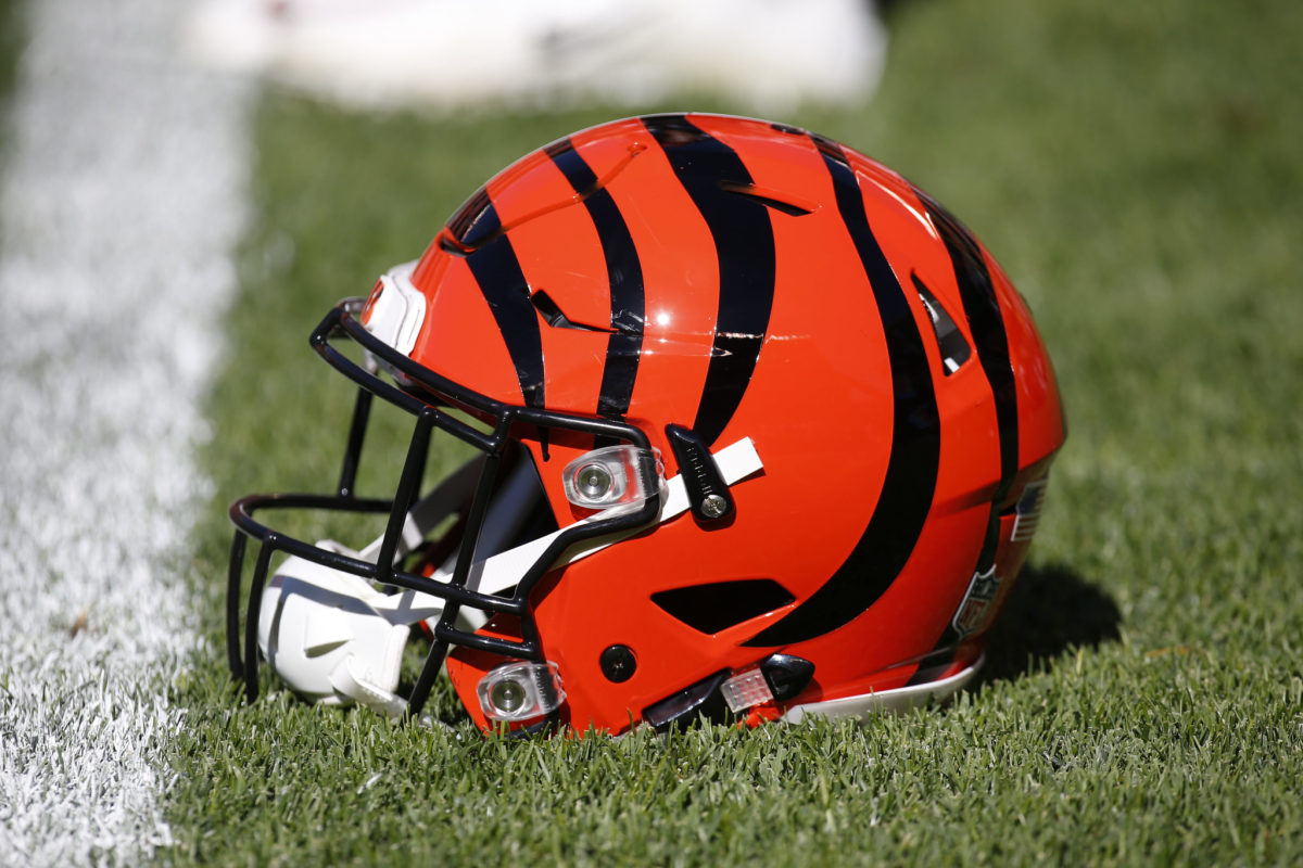 A Cincinnati Bengals helmet sitting on the field.