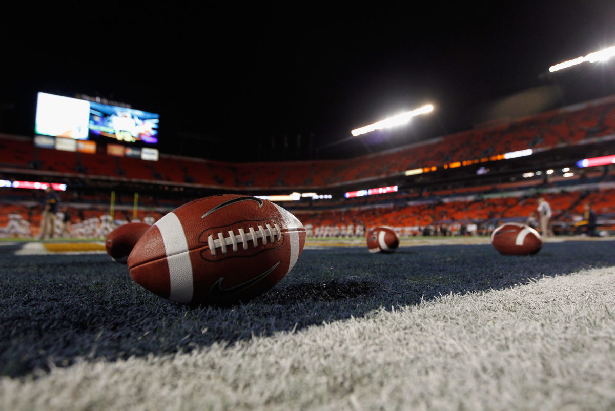 Generic photo of footballs in an end zone.