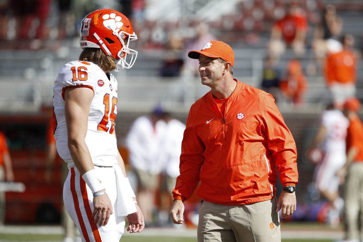 Dabo Swinney and Trevor Lawrence interact during Clemson's win over Florida State.