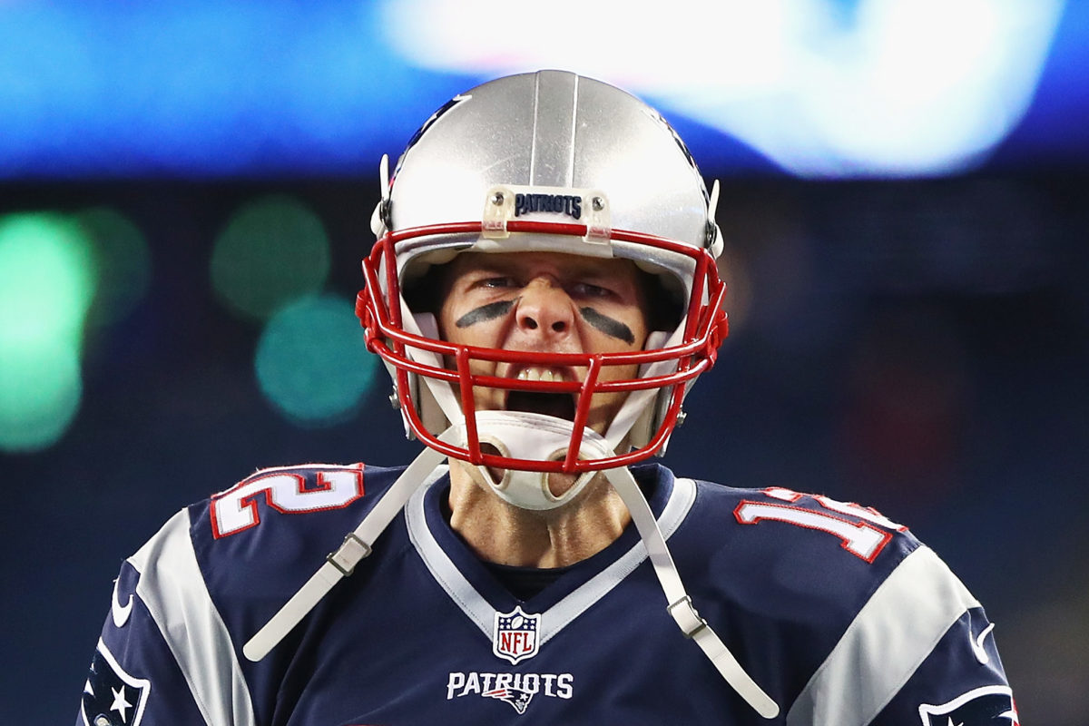 Tom Brady screaming during an NFL game.