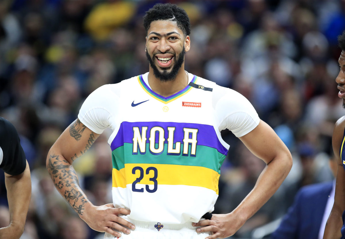 A closeup of Anthony Davis with his hands on his hips.