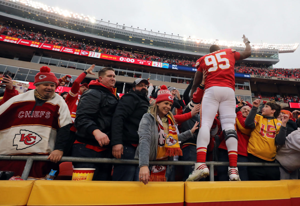 Chris Jones celebrates with Chiefs fans in the stands.