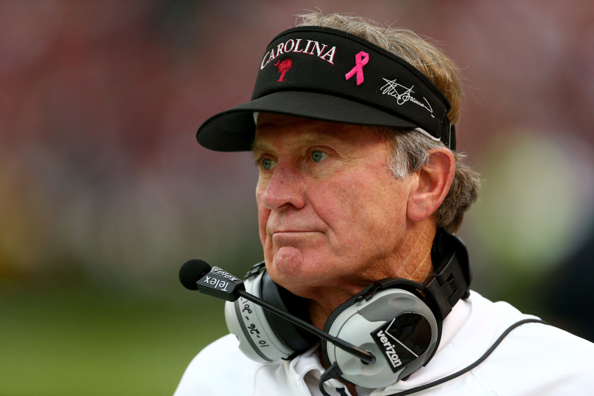Steve Spurrier watches on during game.