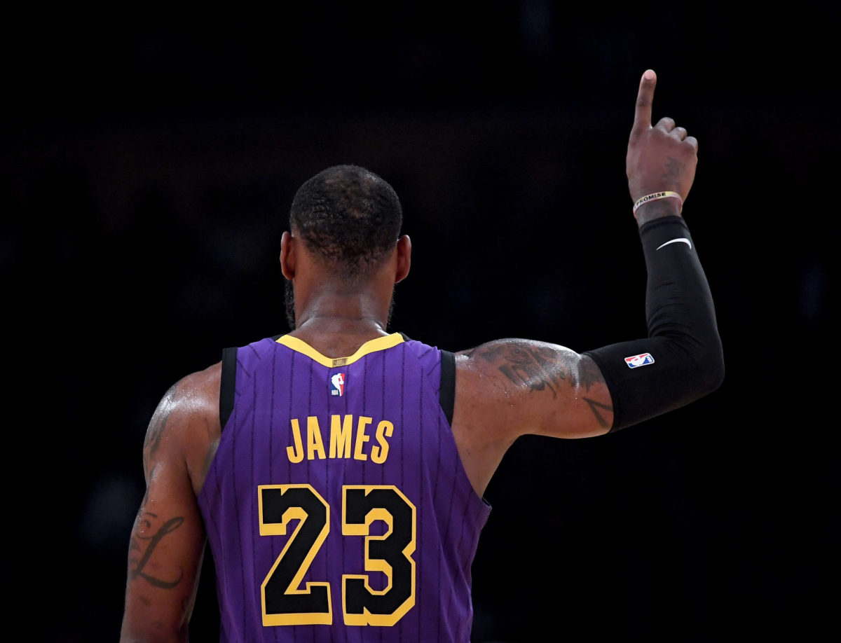 LeBron James holding up one finger during a game.