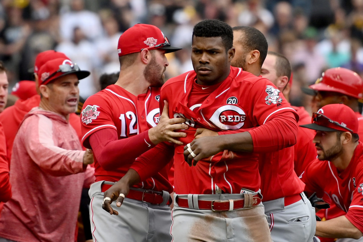 Yasiel Puig is restrained during a brawl.