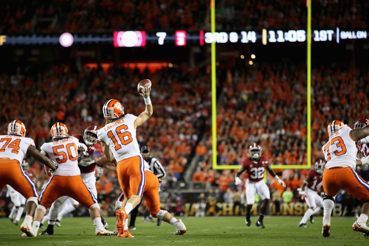 trevor lawrence throws a pass during alabama-clemson college football playoff national championship.