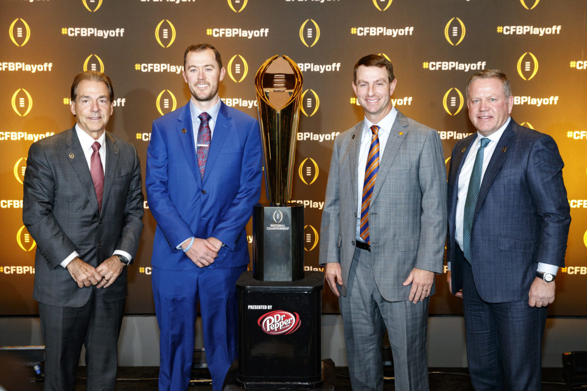 Dabo Swinney, Nick Saban, Lincoln Riley and Brian Kelly with the College Football Playoff trophy.