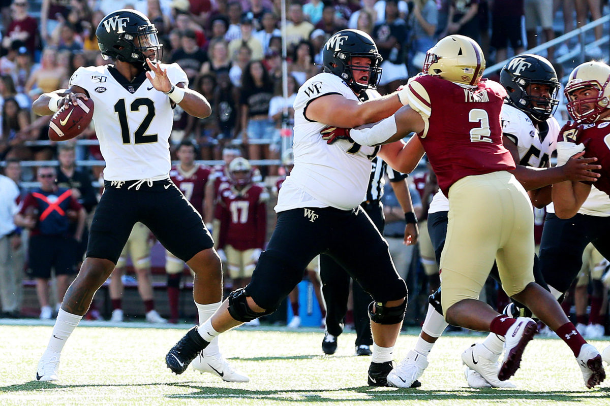 Jamie Newman drops back to pass against Boston College.