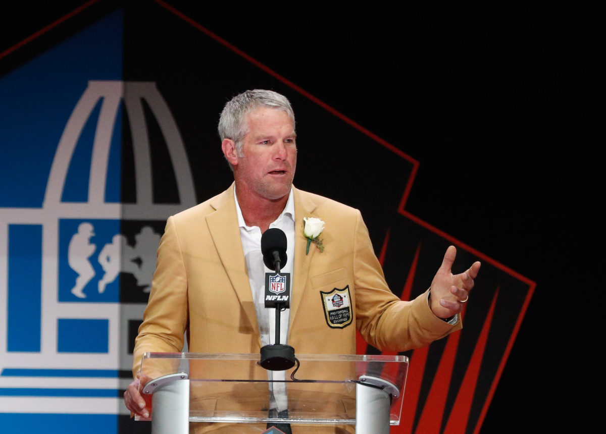 Bret Favre speaking at an event.