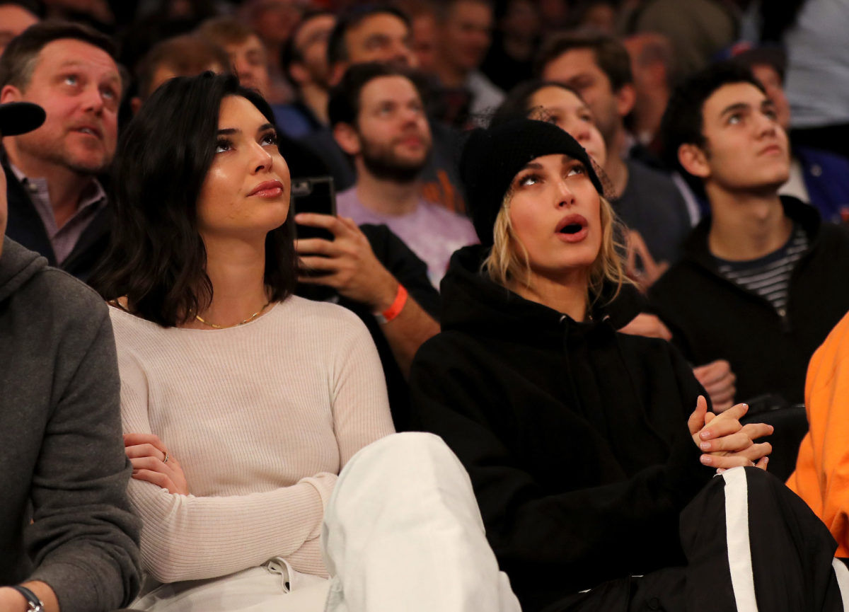 Kendall Jenner and Hailey Baldwin attending an NBA game.