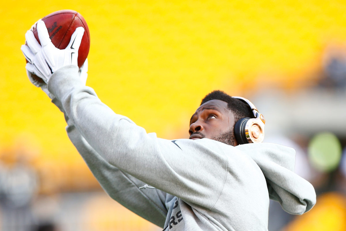 A closeup of Antonio Brown wearing headphones during warmups. The Houston Texans reportedly have interest in the free agent.