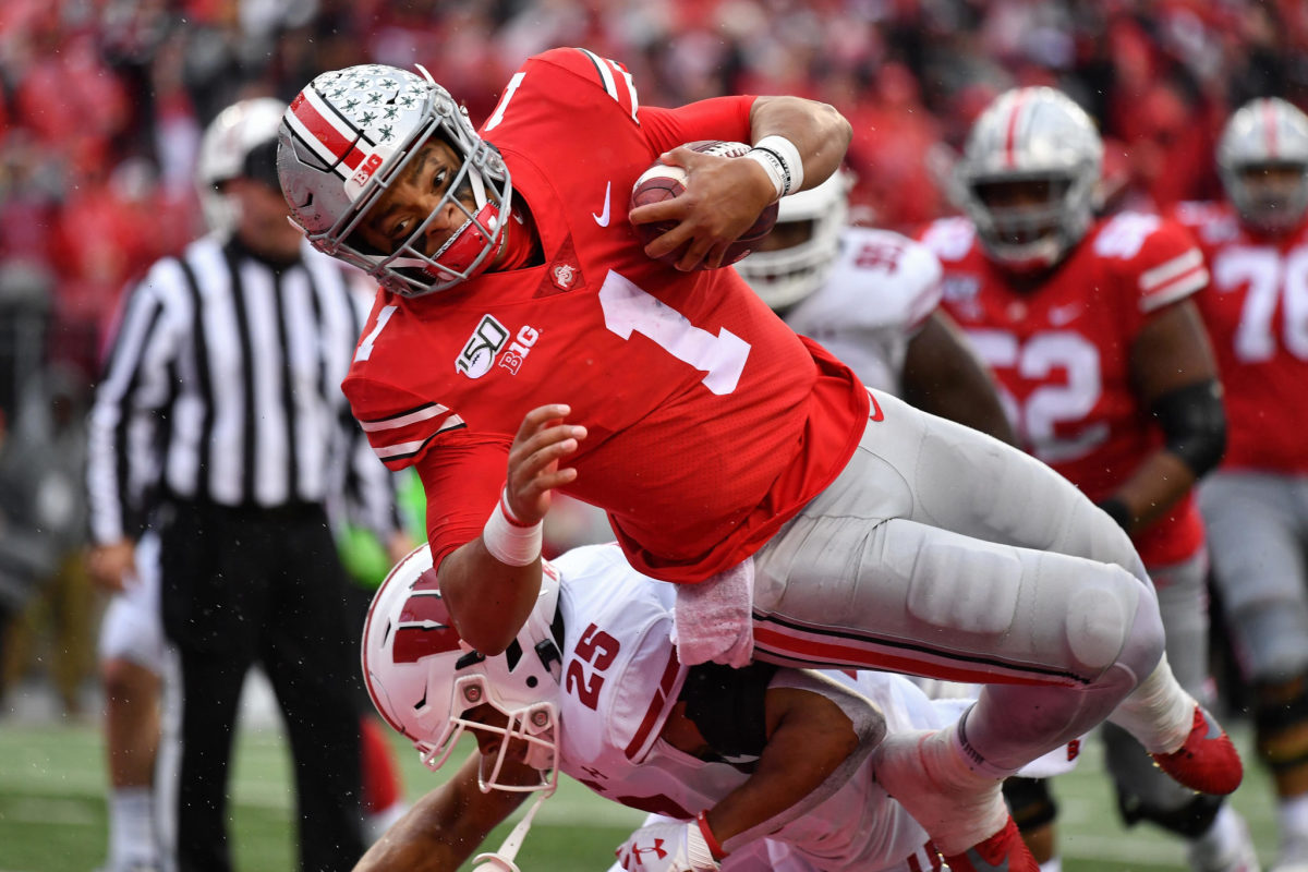 Justin Fields runs for a touchdown against Wisconsin.