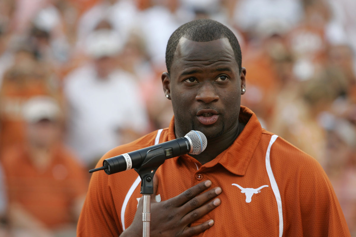 Vince Young speaking into a microphone during a Texas Longhorns game.