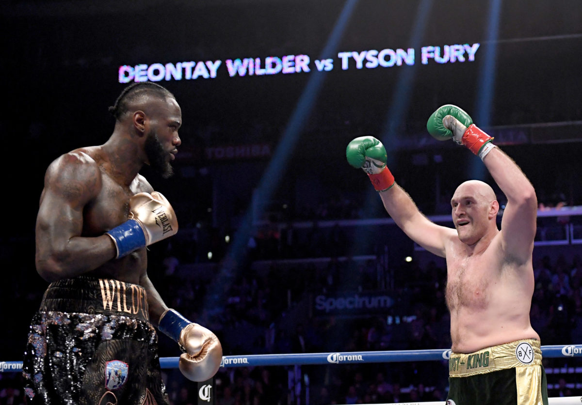Tyson Fury taunts Deontay Wilder during fight.