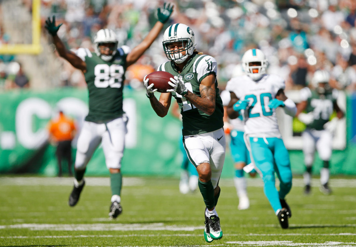 Robby Anderson running to the end zone after catching a pass.